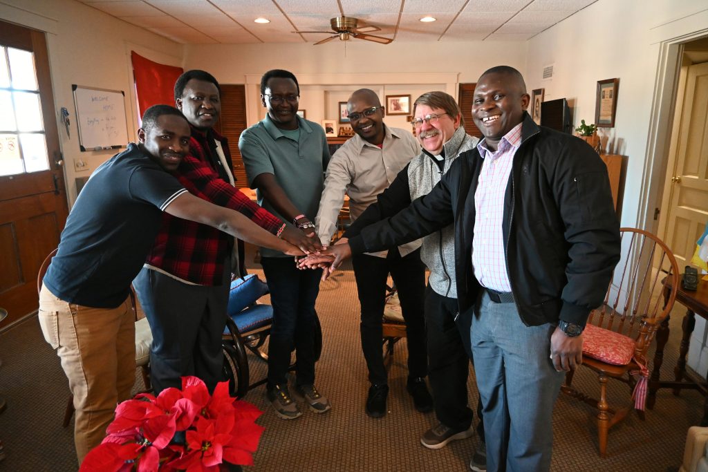 Five Glenmary novices pose at the novitiate house in Cincinnati. From L to R: Evarist Mukama, Alex Omari, Moses Ndung'u, Raphael Kavita and Aloysius Ssenyondo. Fr. Steve Pawelk, Glenmary's second vicepresident and prenovitiate and postnovitiate director, accompanies them.