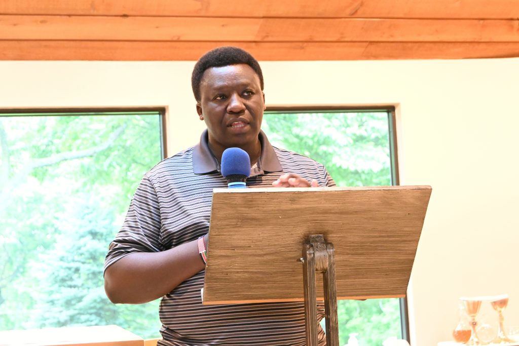 Glenmary novice Alex Omari presents a research paper on the Glenmary Volunteer program since its founding in Kentucky until its current location in Joppa Mountain, Tennessee.